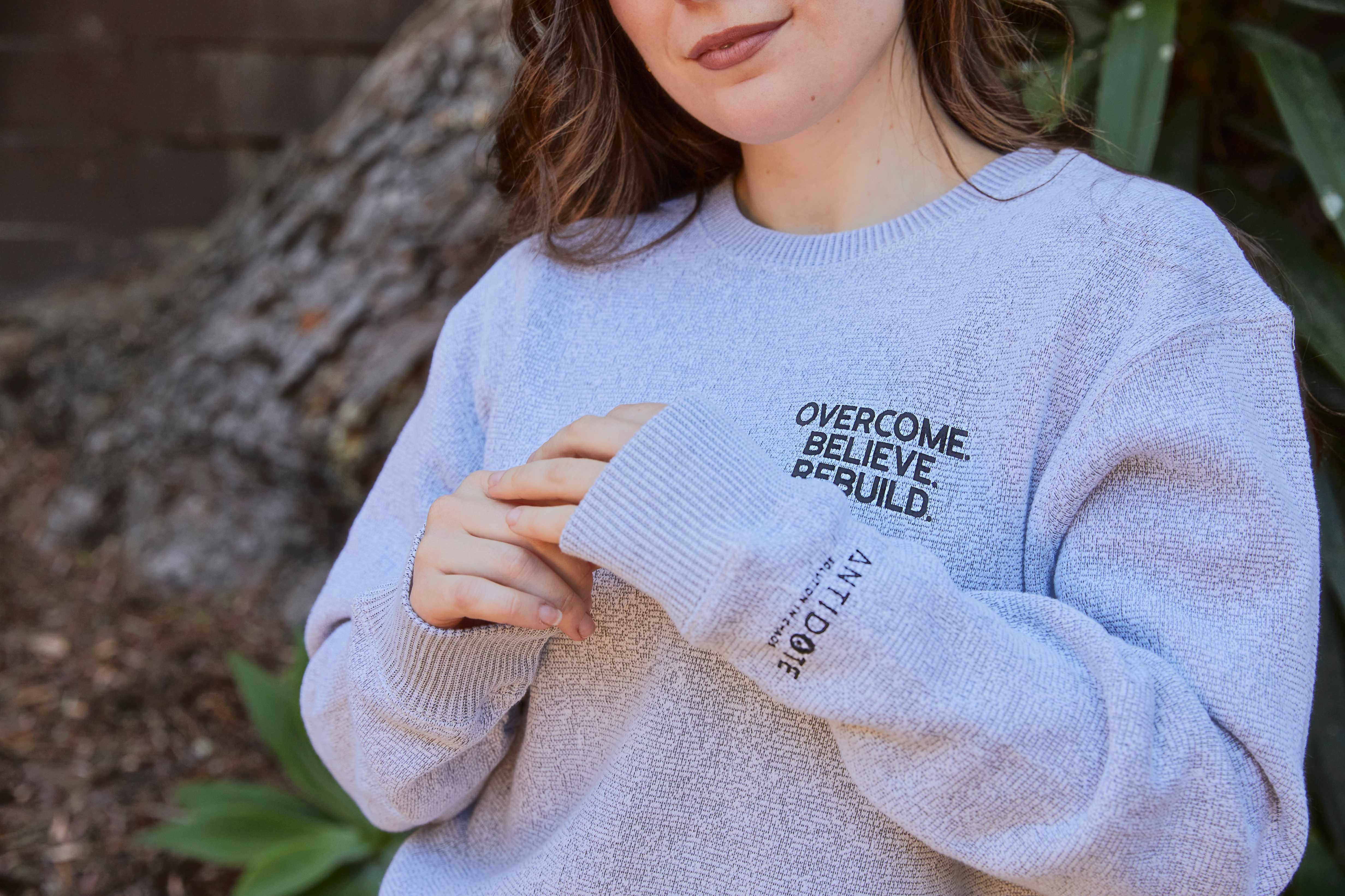 "Overcome. Believe. Rebuild." Sweater